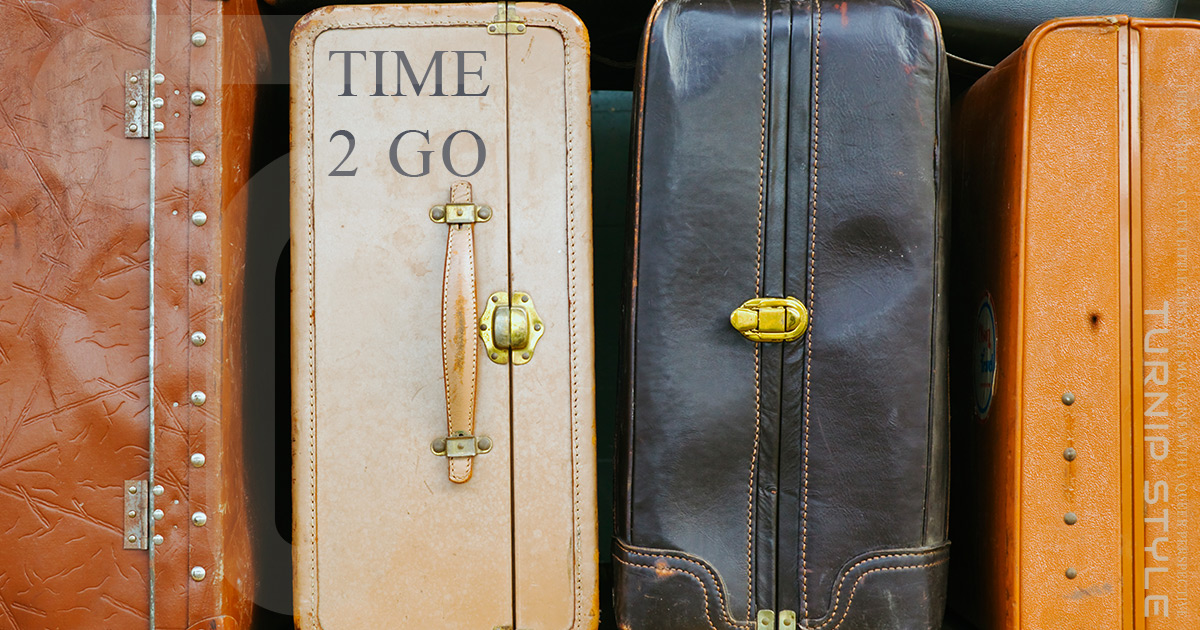 time to go - stack of suitcases