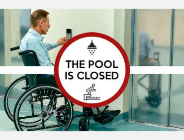 Man in wheelchair calling for an elevator